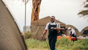 Waiter at tented camp safari Tanzania