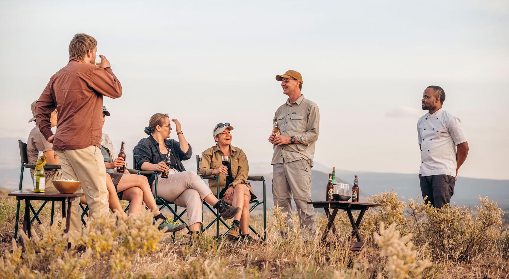 Guests enjoying sundowners on their safari in Tanzania.